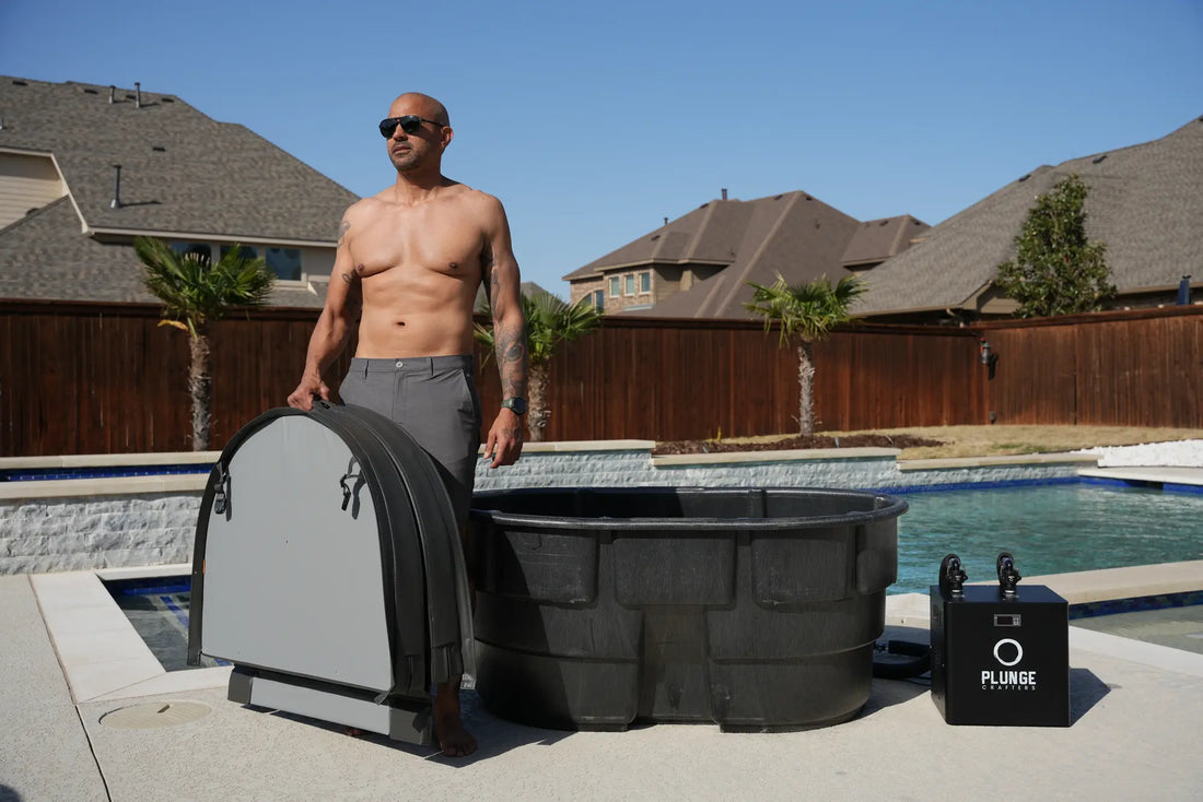 Man standing next to a rubbermaid stock tank