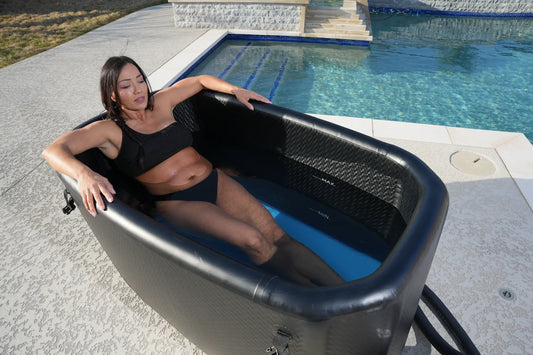 woman laying in a cold plunge tub